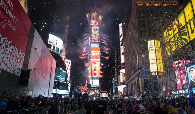 FILE - In this Jan. 1. 2017 file photo, confetti falls as people celebrate the new year in New York&#x27;s Times Square. This year&#x27;s New Year&#x27;s Eve celebration in Times Square will spotlight efforts to combat climate change when high school science teachers and students press the button that begins the famous 60-second ball drop and countdown to next year. “On New Year’s Eve, we look back and reflect on the dominant themes of the past year, and seek hope and inspiration as we look forward,&amp;quot; Times Square Alliance President Tim Tompkins said in a statement Saturday, Dec. 28, 2019 announcing the plan. He said the honorees “are working to solve this global problem through science.” (AP Photo/Craig Ruttle, File)