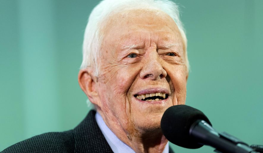 FILE - In this Sept. 18, 2019 file photo, former President Jimmy Carter listens to a question submitted by a student during an annual Carter Town Hall held at Emory University in Atlanta. Carter, the longest living U.S. president in history, recovered from several falls during the year. This was one of the top stories in Georgia in 2019.  (AP Photo/John Amis, File)