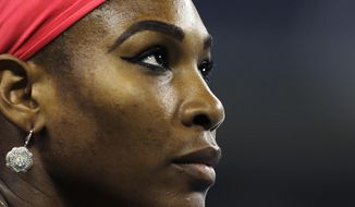 File-This Aug. 23, 2013, file photo shows Serena Williams, of the United States, looking up at the scoreboard during her match against Francesca Schiavone, of Italy, in the first round of the 2013 U.S. Open tennis tournament in New York. Williams has been voted the AP Female Athlete of the Decade for 2010 to 2019. Williams won 12 of her professional-era record 23 Grand Slam singles titles over the past 10 years. No other woman won more than three in that span. She also tied a record for most consecutive weeks ranked No. 1 and collected a tour-leading 37 titles in all during the decade. Gymnast Simone Biles finished second in the vote by AP member sports editors and AP beat writers. Swimmer Katie Ledecky was third, followed by ski racers Lindsey Vonn and Mikaela Shiffrin. (AP Photo/Charles Krupa, File)