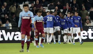 Leicester&#x27;s Kelechi Iheanacho celebrates with teammates after scoring his side&#x27;s opening goal during the English Premier League soccer match between West Ham Utd and Leicester City at the London Stadium in London, Saturday, Dec. 28, 2019. (AP Photo/Petros Karadjias)