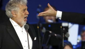 FILE - In this Wednesday, Aug. 28, 2019 file photo, opera star Placido Domingo performs during a concert in Szeged, Hungary. Domingo continued his calendar of European engagements despite allegations of sexual harassment, appearing here for a performance to inaugurate a sports complex for a local Catholic diocese. Two investigations into Domingo&#39;s behavior were opened in 2019 after Associated Press stories in which more than 20 women said the legendary tenor had pressured them into sexual relationships, behaved inappropriately and sometimes professionally punished those who rebuffed him. Dozens of others told the AP that they had witnessed his behavior. (AP Photo/Laszlo Balogh)