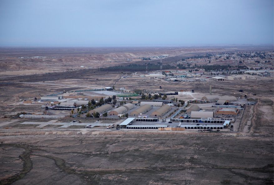 This aerial photo taken from a helicopter shows Ain al-Asad air base in the western Anbar desert, Iraq, Sunday, Dec. 29, 2019. An Iraqi general said Sunday that security has been beefed up around the Ain al-Asad air base, a sprawling complex that hosts U.S. forces, following a series of attacks. (AP Photo/Nasser Nasser) (ASSOCIATED PRESS)