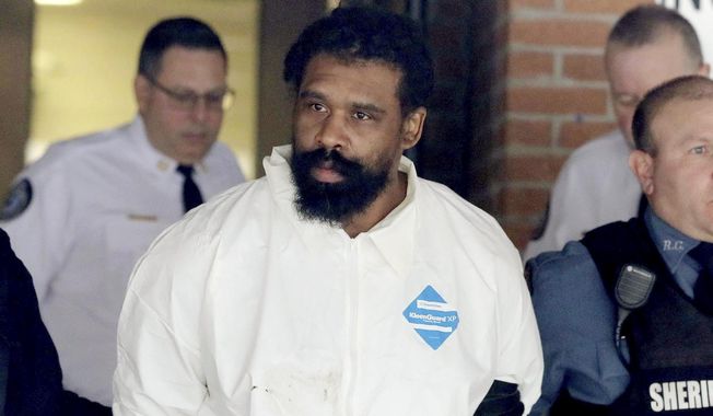 Grafton Thomas is led from Ramapo Town Hall in Ramapo, N.Y. following his arraignment Sunday, Dec. 29, 2019. Thomas was charged in the stabbings of multiple people as they gathered to celebrate Hanukkah at a rabbi&#x27;s home in Monsey, an Orthodox Jewish community north of New York City.  (Seth Harrison/The Journal News via AP)