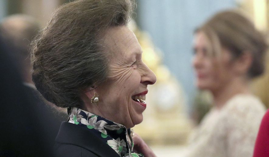 FILE - In this Tuesday, Dec. 3, 2019 file photo, Britain's Princess Anne talks to guests during a reception at Buckingham Palace, as NATO leaders gather to mark 70 years of the alliance, in London. The British royal family might be known for smiling and waving in fancy outfits, but they work just as hard as anyone else…right? According to official records, prominent members of the royal family worked on average 84.5 days, a third of the 253 working days in 2019. The Queen’s only daughter, Princess Anne, was the hardest working royal for the second year in a row, working a total of 167 days. (Yui Mok/Pool Photo via AP, File)