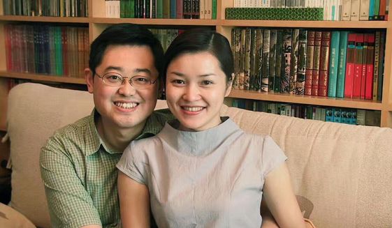 In this 2000 photo provided by ChinaAid, pastor Wang Yi, left, poses with his wife Jiang Rong at the study room of their home. China on Monday, Dec. 30, 2019, sentenced the prominent pastor who operated outside the Communist Party-recognized Protestant organization to nine years in prison. The People&#39;s Intermediate Court in the southwestern city of Chengdu said Wang Yi was also convicted of illegal business operations, fined and had his personal assets seized. (ChinaAid via AP)  **FILE**