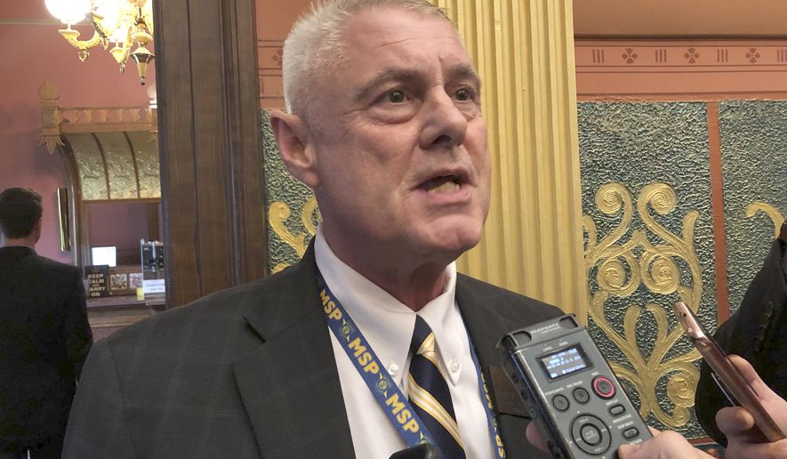 FILE - In a Tuesday, Sept. 3, 2019 file photo, State Rep. Larry Inman, R-Williamsburg, speaks with reporters, in the House chamber in Lansing, Mich. The Michigan Supreme Court ordered Monday, Dec. 30, 2019 that an attempt to recall Inman from office continue, reversing a lower court that said election officials correctly disqualified the petition over a missing word. (AP Photo/David Eggert, File)