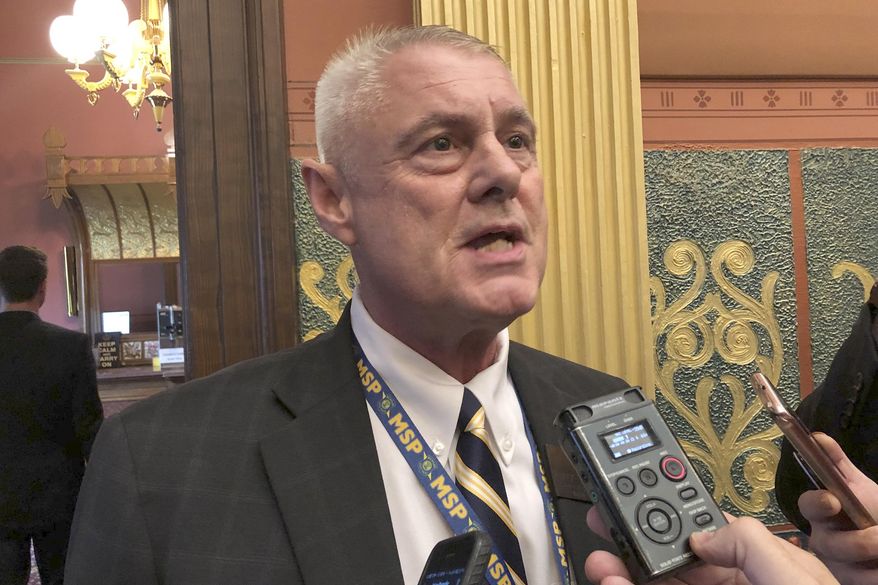 FILE - In a Tuesday, Sept. 3, 2019 file photo, State Rep. Larry Inman, R-Williamsburg, speaks with reporters, in the House chamber in Lansing, Mich. The Michigan Supreme Court ordered Monday, Dec. 30, 2019 that an attempt to recall Inman from office continue, reversing a lower court that said election officials correctly disqualified the petition over a missing word. (AP Photo/David Eggert, File)
