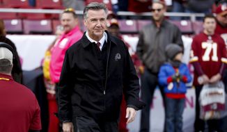 FILE - In this Oct. 21, 2018 file photo, Washington Redskins President Bruce Allen walks across the field before an NFL football game against the Dallas Cowboys in Landover, Md. Allen was fired Monday, Dec. 30, 2019, after a tumultuous and loss-filled decade with the NFL team once coached by his father.  (AP Photo/Andrew Harnik, File)
