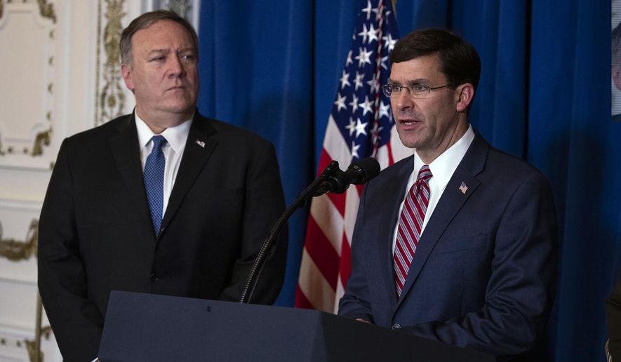 Secretary of State Mike Pompeo, left, listens as Secretary of Defense Mark Esper delivers a statement on Iraq and Syria at President Donald Trump&#39;s Mar-a-Lago property, Sunday, Dec. 29, 2019, in Palm Beach, Fla. (AP Photo/ Evan Vucci) ** FILE **