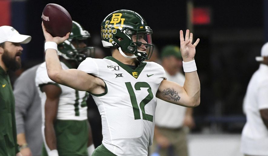 Baylor quarterback Charlie Brewer warms up before an NCAA college football game against OKlahoma at the Big 12 Conference championship, Saturday, Dec. 7, 2019, in Arlington, Texas. (AP Photo/Jeffrey McWhorter)