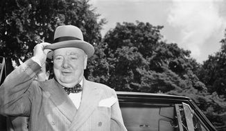 In this June 29, 1954, file photo, British Prime Minister Winston Churchill holds his hat as he arrives at the White House in Washington. (AP Photo/Charles Gorry, file)