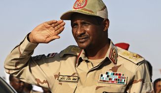 FILE - In this June 15, 2019 file photo, Gen. Mohammed Hamdan Dagalo, the deputy head of the military council, salutes during a rally, in Galawee, northern Sudan. Sudan’s transitional authorities and a rebel faction reached a peace deal, part of government efforts to end the country’s decadeslong civil wars. The government said it signed the deal Tuesday, Dec. 24, 2019, with a faction of the Sudan Revolutionary Front in South Sudan&#x27;s capital, Juba. The deal could pave the way for other peace agreements with more factions, as well as other rebel groups. (AP Photo, File)