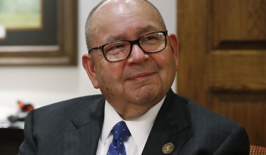 FILE - In this Sept. 17, 2019 file photo, Bill Anoatubby, Governor of the Chickasaw Nation, is pictured during an interview in his office in Ada, Okla. Three of the most powerful Indian tribes in Oklahoma are suing the governor over agreements that allow gambling at tribal casinos. The Cherokee, Chickasaw and Choctaw nations filed the complaint Tuesday, Dec. 31, 2019, in federal court in Oklahoma City. The tribes are asking a federal judge to decide whether the state's gaming compacts with the tribes expire on Jan. 1. (AP Photo/Sue Ogrocki File)