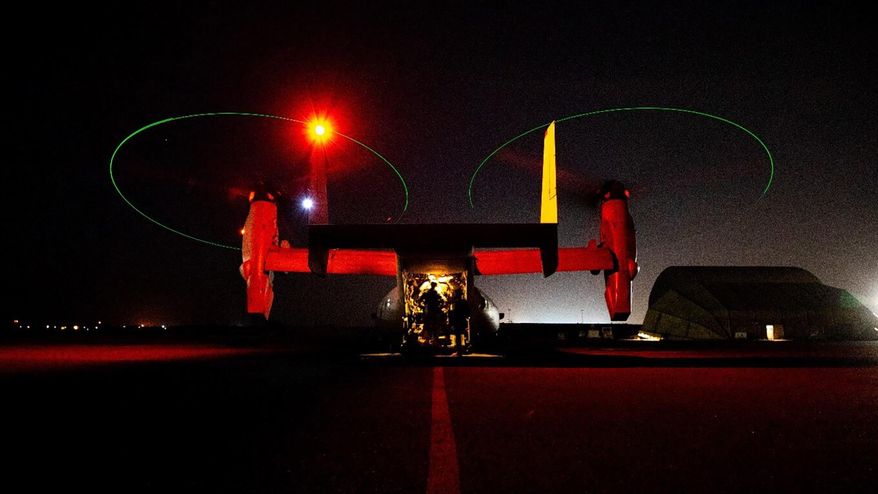 In this photo provided by U.S. Department of Defense, the Army&#39;s AH-64 Apache helicopter from 1st Battalion, 227th Aviation Regiment, 34th Combat Aviation Brigade, prepares to conduct overflights of the U.S. Embassy in Baghdad, Iraq, Tuesday, Dec. 31, 2019. Helicopters later launched flares as a show of presence while providing additional security and deterrence against protesters. (U.S. Army photo by Spc. Khalil Jenkins, CJTF-OIR Public Affairs via AP)
