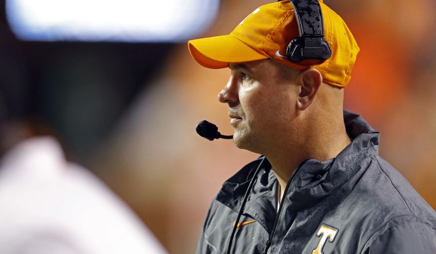 Tennessee head coach Jeremy Pruitt watches the first half of an NCAA college football game against Vanderbilt, Saturday, Nov. 30, 2019, in Knoxville, Tenn. (AP Photo/Wade Payne)