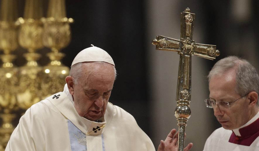 Pope Francis presides over a Mass for the solemnity of St. Mary at the beginning of the new year, in St. Peter's Basilica at the Vatican, Wednesday, Jan. 1, 2020. (AP Photo/Gregorio Borgia)