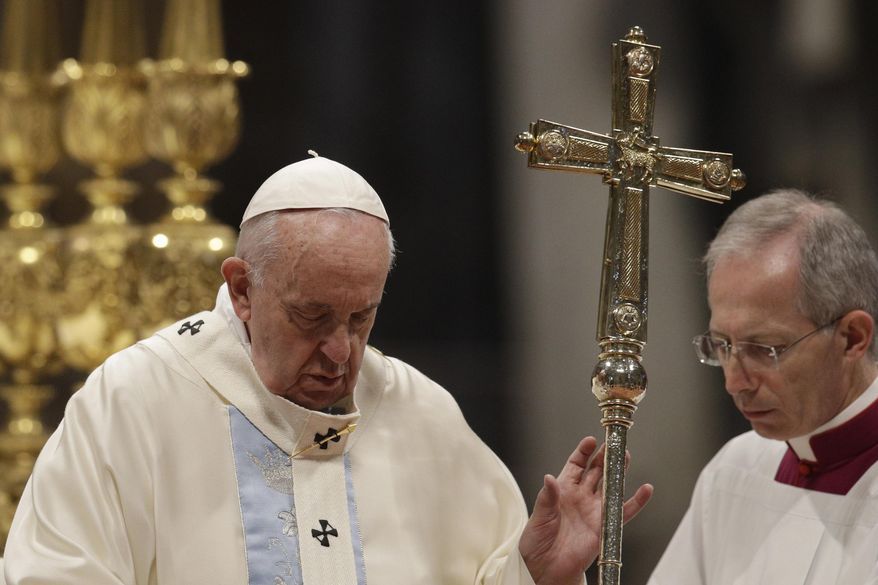 Pope Francis presides over a Mass for the solemnity of St. Mary at the beginning of the new year, in St. Peter's Basilica at the Vatican, Wednesday, Jan. 1, 2020. (AP Photo/Gregorio Borgia)