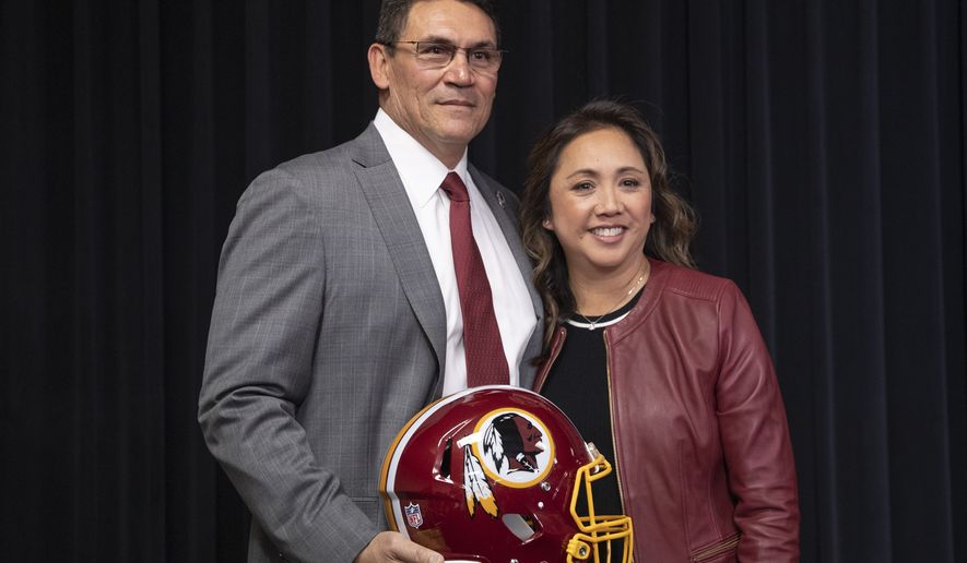 Washington Redskins new head coach Ron Rivera, left, and his wife Stephanie Rivera, pose for a picture during a news conference at the team's NFL football training facility, Thursday, Jan. 2, 2020 in Ashburn, Va. (AP Photo/Alex Brandon) ** FILE **