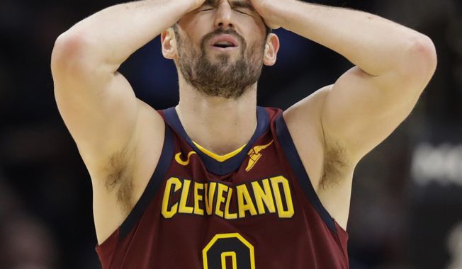 Cleveland Cavaliers&#x27; Kevin Love reacts after missing a three-point basket late in the second half of an NBA basketball game against the Charlotte Hornets, Thursday, Jan. 2, 2020, in Cleveland. (AP Photo/Tony Dejak)