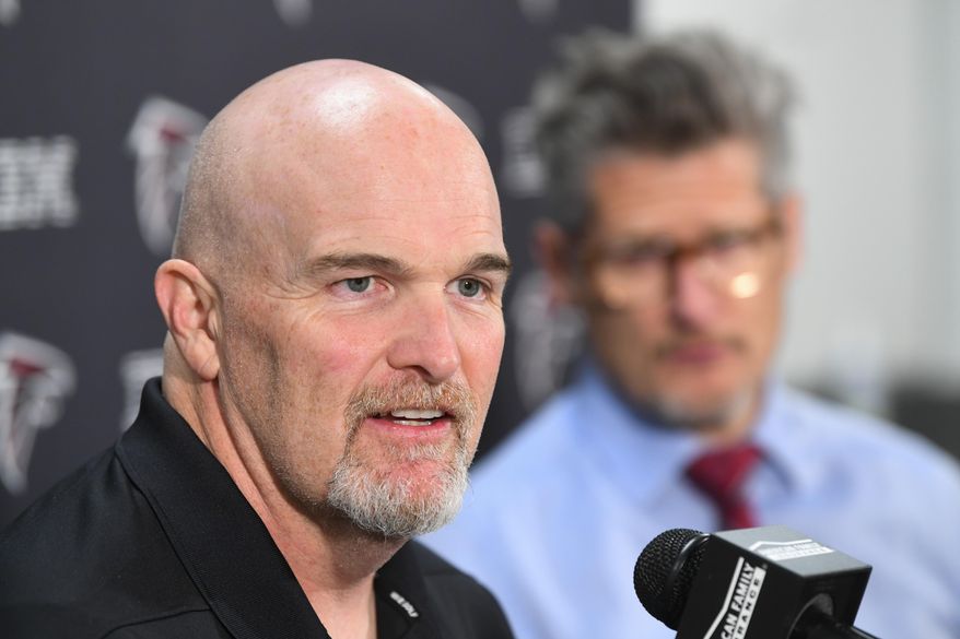 Atlanta Falcons coach Dan Quinn, left, and general manager Thomas Dimitroff face the media during a news conference held by the NFL football team, Monday, Dec. 30, 2019, in Flowery Branch, Ga. Quinn and Dimitroff were in the hot seat earlier this season after a poor start, but owner Arthur Blank made the decision to retain both of them last week. (John Amis/Atlanta Journal-Constitution via AP)
