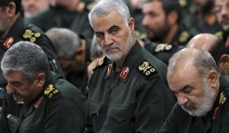 In this Sept. 18, 2016, file photo provided by an official website of the office of the Iranian supreme leader, Revolutionary Guard Gen. Qassem Soleimani, center, attends a meeting in Tehran, Iran. Iraqi TV and three Iraqi officials said Friday, Jan. 3, 2020, that Soleimani, the head of Iran’s elite Quds Force, has been killed in an airstrike at Baghdad’s international airport. (Office of the Iranian Supreme Leader via AP, File)
