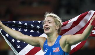 FILE - In this Thursday, Aug. 18, 2016, file photo, United States&#39; Helen Louise Maroulis celebrates after winning the gold medal during the women&#39;s 53-kg freestyle wrestling competition at the 2016 Summer Olympics in Rio de Janeiro. Maroulis was one of the most celebrated Olympians in 2016 when she became the first American to win a gold medal in women’s wrestling, and she was expected to be one of the faces of the sport in Tokyo in 2020. She still might be if she’s able to qualify. (AP Photo/Markus Schreiber, File)