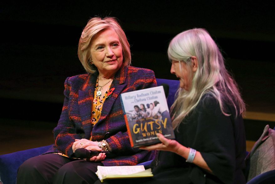 U.S. former Secretary of State Hillary Clinton, left, talks to classicist Mary Beard, at the Southbank Centre in London during the launch of "Gutsy Women: Favorite Stories of Courage and Resilience," a book by Chelsea and Hillary Clinton, in London, Sunday, Nov. 10, 2019. (Aaron Chown/PAvia AP)'