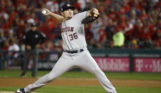 In this Oct. 25, 2019, file photo, Houston Astros relief pitcher Will Harris throws against the Washington Nationals during the seventh inning of Game 3 of the baseball World Series, in Washington. Relief pitcher Will Harris is joining the Washington Nationals after they beat him in Game 7 of the World Series against the Houston Astros. Harris and the Nationals have agreed to a $24 million, three-year contract, according to a person with direct knowledge of the deal. The person spoke to The Associated Press on condition of anonymity Friday, Jan. 3, 2020, because the agreement has not been announced. (AP Photo/Patrick Semansky, File)  **FILE**