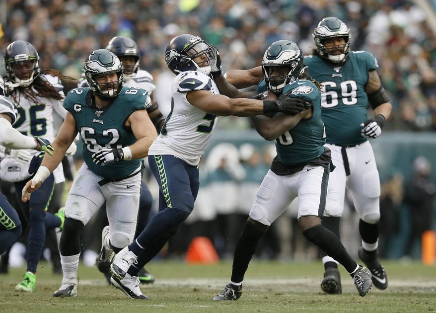 FILE - In this Nov. 24, 2019, file photo, Philadelphia Eagles&#39; Jay Ajayi (28) tries to break free from Seattle Seahawks&#39; Bobby Wagner during the second half of an NFL football game in Philadelphia. Wagner was named to The Associated Press&#39; All-Pro Team for the fifth time. (AP Photo/Michael Perez, File)