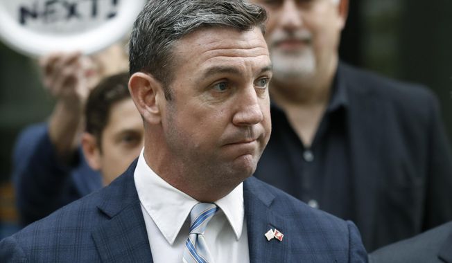 FILE - In this Tuesday, Dec. 3, 2019, file photo, California Republican Rep. Duncan Hunter speaks after leaving federal court in San Diego. Hunter is staying mum on when he will resign following his guilty plea for siphoning campaign money for personal expenses, drawing the ire of a fellow Republican seeking to replace him. Hunter said last month that he would step down &amp;quot;shortly after the holidays.&amp;quot; (AP Photo/Gregory Bull, File)