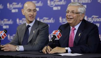FILE - In this Thursday, June 6, 2013 file photo, David Stern, NBA Commissioner, right, and Adam Silver, Deputy Commissioner, speak before the start of Game 1 of the NBA Finals basketball game between the San Antonio Spurs and Miami Heat in Miami. David Stern, who spent 30 years as the NBA&#39;s longest-serving commissioner and oversaw its growth into a global power, has died on New Year’s Day, Wednesday, Jan. 1, 2020. He was 77. (AP Photo/Wilfredo Lee, File)
