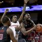 Rutgers&#39; Akwasi Yeboah, right, goes to the basket in front of Nebraska&#39;s Kevin Cross (1), as Shaq Carter (13) watches during the first half of an NCAA college basketball game in Lincoln, Neb., Friday, Jan. 3, 2020. (AP Photo/Nati Harnik)