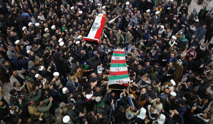 Mourners carry the coffins of Iran&#39;s Gen. Qassem Soleimani and Abu Mahdi al-Muhandis, deputy commander of Iran-backed militias at the Imam Ali shrine in Najaf, Iraq, Saturday, Jan. 4, 2020. Iran has vowed &amp;quot;harsh retaliation&amp;quot; for the U.S. airstrike near Baghdad&#39;s airport that killed Tehran&#39;s top general and the architect of its interventions across the Middle East, as tensions soared in the wake of the targeted killing. (AP Photo/Anmar Khalil)