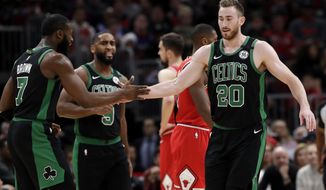 Boston Celtics forward Gordon Hayward, right, celebrates with forward Jaylen Brown after scoring a basket during the first half of the team&#39;s NBA basketball game against the Chicago Bulls in Chicago, Saturday, Jan. 4, 2020. (AP Photo/Nam Y. Huh)