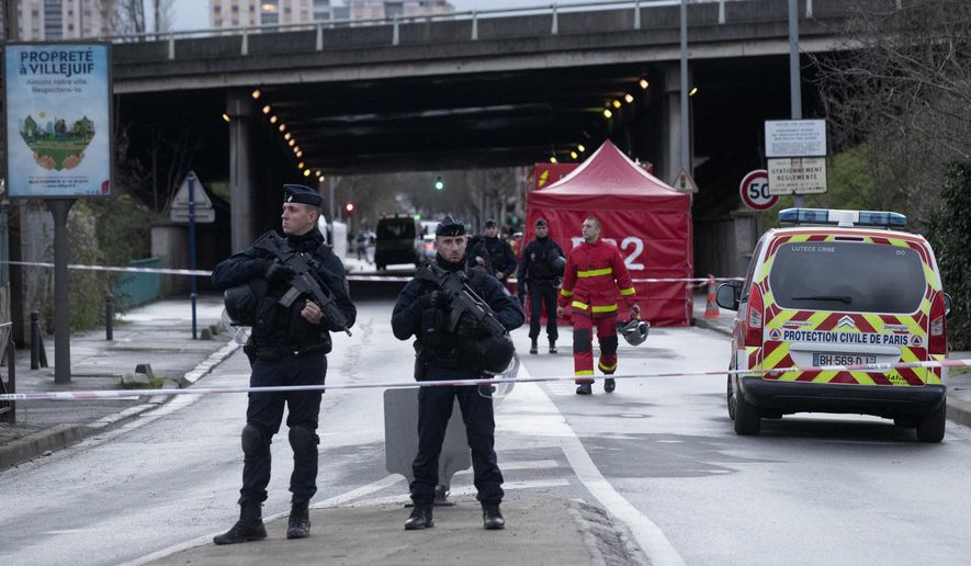Riot police officers secure the area after a man attacked passerby Friday Jan.3, 2020 in Villejuif, south of Paris. A man armed with a knife rampaged through a Paris park attacking passers-by seemingly at random Friday, killing at least one person and injuring two others before police shot him dead, officials said. (AP Photo/Michel Euler)