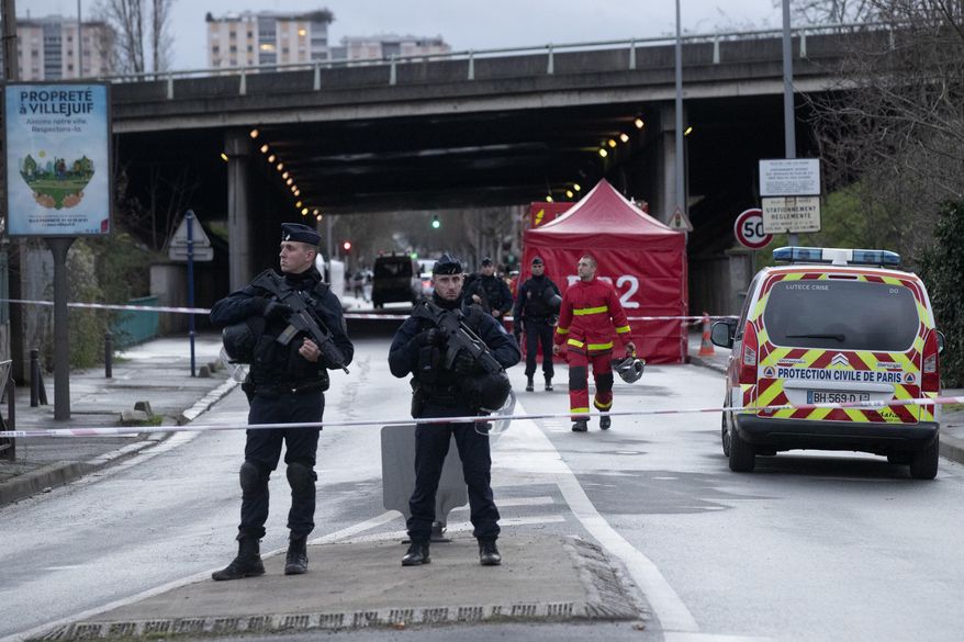 Riot police officers secure the area after a man attacked passerby Friday Jan.3, 2020 in Villejuif, south of Paris. A man armed with a knife rampaged through a Paris park attacking passers-by seemingly at random Friday, killing at least one person and injuring two others before police shot him dead, officials said. (AP Photo/Michel Euler)