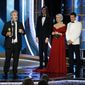 This image released by NBC shows Sam Mendes accepting the award for best director for the film &quot;1917&quot; as presenters Antonio Banderas, right, and Helen Mirren look on at the 77th Annual Golden Globe Awards at the Beverly Hilton Hotel in Beverly Hills, Calif., on Sunday, Jan. 5, 2020. (Paul Drinkwater/NBC via AP)