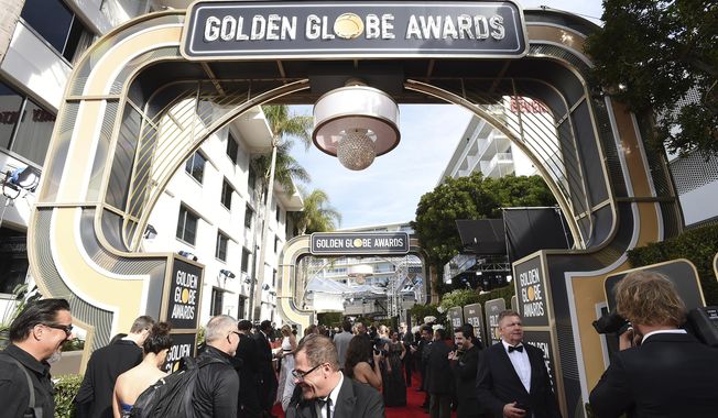 Media set up on the red carpet prior to the start of the 77th annual Golden Globe Awards at the Beverly Hilton Hotel on Sunday, Jan. 5, 2020, in Beverly Hills, Calif. (Photo by Jordan Strauss/Invision/AP)