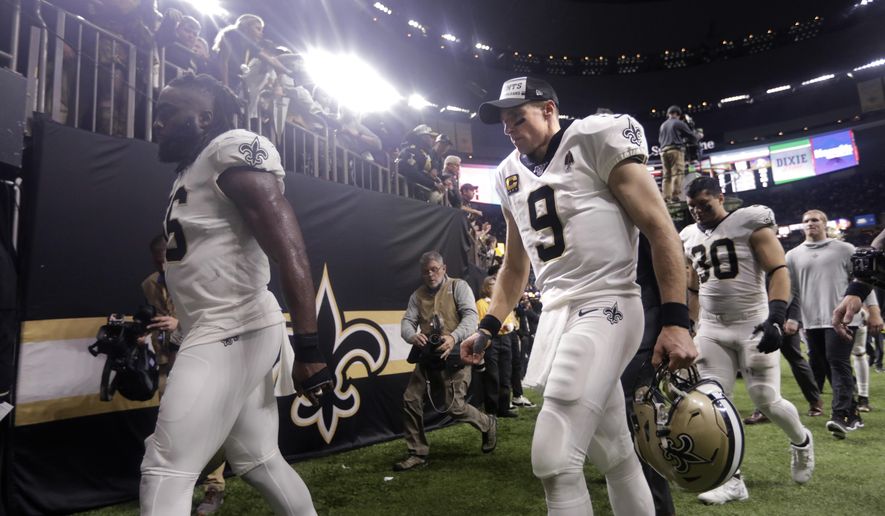 New Orleans Saints quarterback Drew Brees (9) walks off the field after their overtime loss to the Minnesota Vikings in an NFL wild-card playoff football game, Sunday, Jan. 5, 2020, in New Orleans. The Vikings won 26-20. (AP Photo/Brett Duke)