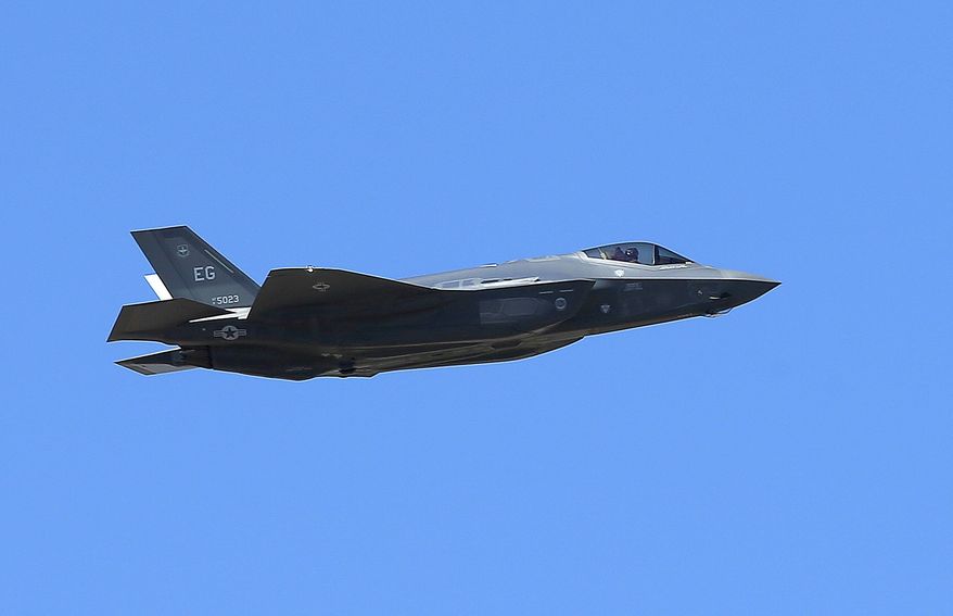 In this March 14, 2014, file photo, a U.S. Air Force F-35A Lightning II makes a flyby after an unveiling celebration takes place at Luke Air Force Base for the delivery of the first F-35A fighter jet, in Glendale, Ariz. The U.S. Air Force has selected National Guard bases in Alabama and Wisconsin as homes for new F-35A fighter squadrons. Air Force officials announced Thursday, Dec. 21, 2017, that Truax Field Air National Guard Base in Wisconsin and Dannelly Field in Montgomery, Alabama are the preferred locations for the squadrons. (AP Photo/Ross D. Franklin, File)
