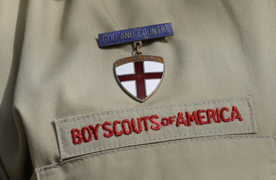FILE - This Feb. 4, 2013 file photo shows a close up of a Boy Scout uniform badge during a news conference in front of the Boy Scouts of America headquarters in Irving, Texas. A team of lawyers filed a lawsuit on Monday, Jan. 6, 2020, in federal court in Washington, D.C., seeking to establish the nation’s capital as a venue for men across the U.S. to sue the Boy Scouts of America for allegedly failing to protect them from long-ago sexual abuse at the hands of scoutmasters and other scout leaders. (AP Photo/Tony Gutierrez, File)