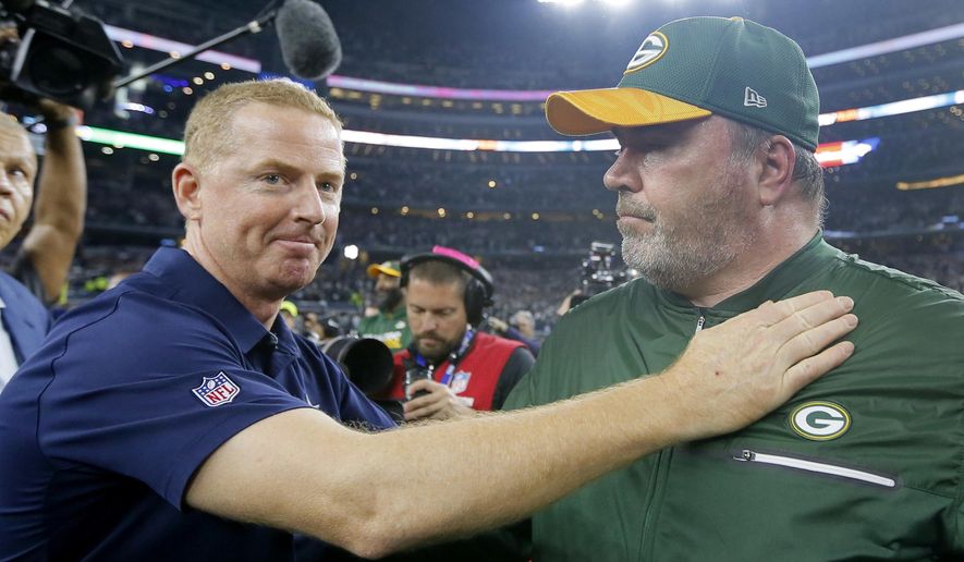 FILE - In this Jan. 15, 2017, file photo, Dallas Cowboys coach Jason Garrett, left, congratulates Green Bay Packers coach Mike McCarthy after their 34-31 win in an NFL divisional playoff football game in Arlington, Texas. The Dallas Cowboys didn't take long to settle on Mike McCarthy as their coach after waiting a week to announce they were moving on from Jason Garrett. McCarthy, who won a Super Bowl at the home of the Cowboys nine years ago as Green Bay's coach, has agreed to become the ninth coach in team history, a person with direct knowledge of the deal said Monday, Jan. 6, 2020.The person spoke to The Associated Press on condition of anonymity because the team hasn't announced the move. (AP Photo/Tony Gutierrez, File)