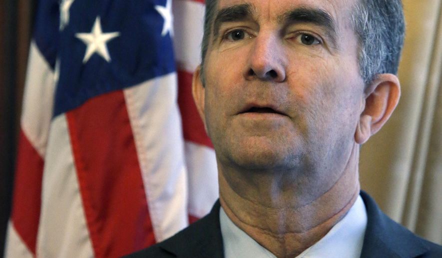 Gov. Ralph Northam prepares to adress a press conference at the State Capitol Monday, Jan. 6, 2020 where he previewed his voting legislative proposals, including removing Lee-Jackson Day as a state holiday and replacing it with election day. (Bob Brown/Richmond Times-Dispatch via AP)