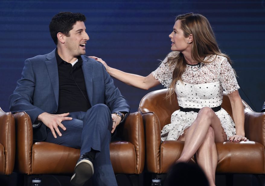 Jason Biggs, left, and Maggie Lawson, cast members in the upcoming television series "Outmatched," interact onstage during the 2020 FOX Television Critics Association Winter Press Tour, Tuesday, Jan. 7, 2020, in Pasadena, Calif. (AP Photo/Chris Pizzello)