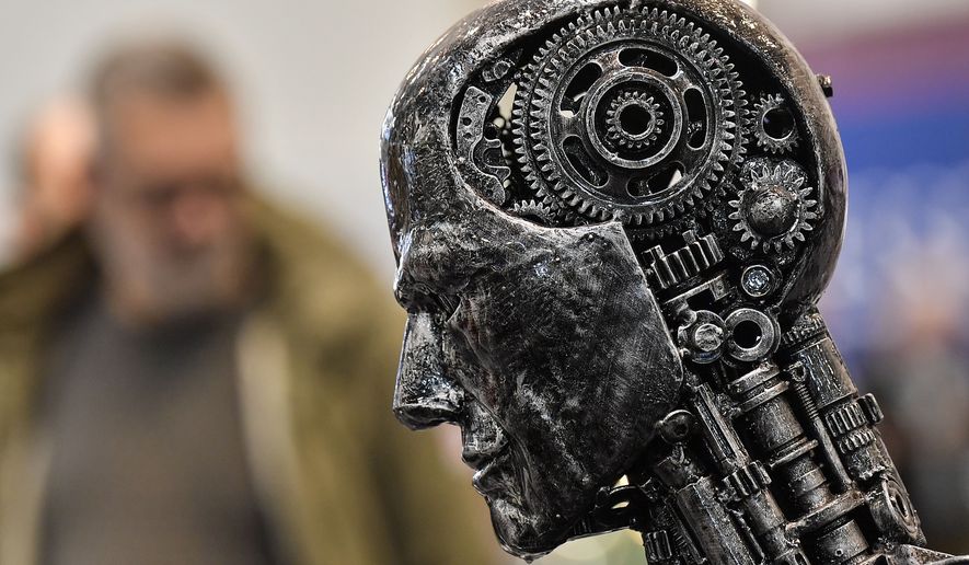 In this Nov. 29, 2019, file photo, a metal head made of motor parts symbolizes artificial intelligence, or AI, at the Essen Motor Show for tuning and motorsports in Essen, Germany. The Defense Intelligence Agency is putting the finishing touches on a new artificial intelligence strategy designed to stop powerful new technologies in the pipeline from bypassing their human masters on decisions leading to war or peace. (AP Photo/Martin Meissner) **FILE**