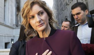 FILE - In this Oct. 18, 2018, file photo, Summer Zervos leaves New York state appellate court in New York. Zervos&#39; lawsuit over President Donald Trump&#39;s response to her sexual assault allegations was put on hold Tuesday, Jan. 7, 2020, when a court froze the case until New York&#39;s top court weighs whether to dismiss the case or delay it through his presidency.  (AP Photo/Mary Altaffer, File)