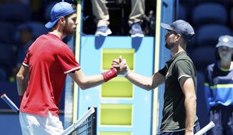Russia&#x27;s Karen Khachanov, left, shakes hands over the net with Norway&#x27;s Viktor Durasovic after their ATP Cup tennis match in Perth, Australia, Tuesday, Jan. 7, 2020. (AP Photo/Trevor Collens)