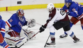 New York Rangers&#x27; Igor Shesterkin (31) stops a shot by Colorado Avalanche&#x27;s Nazem Kadri (91) during the third period of an NHL hockey game Tuesday, Jan. 7, 2020, in New York. The Rangers won 5-3. (AP Photo/Frank Franklin II)