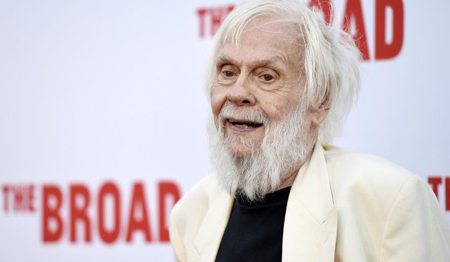 FILE - In this Thursday, Sept. 17, 2015, file photo, artist John Baldessari poses at The Broad museum's opening and inaugural dinner in Los Angeles. Baldessari, who pioneered a new genre of art in the 1970s and in the process helped elevate Los Angeles' status in the art world from that of back-water berg to a center of the conceptual movement, has died at age 88. Baldessari died Thursday at his home in Los Angeles, the artist's representatives at New York's Marian Goodman Gallery, confirmed Monday, Jan. 6, 2020. (Photo by Chris Pizzello/Invision/AP)