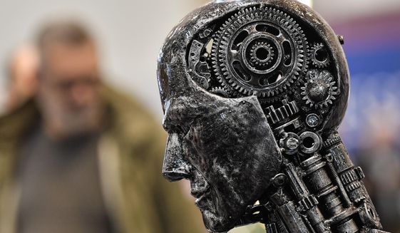 In this Nov. 29, 2019, file photo, a metal head made of motor parts symbolizes artificial intelligence, or AI, at the Essen Motor Show for tuning and motorsports in Essen, Germany. Microsoft chief scientific officer Eric Horvitz warned lawmakers on Tuesday that America&#39;s application of artificial intelligence is not living up to its full potential. (AP Photo/Martin Meissner, File)